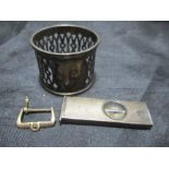 A hallmarked silver cigar cutter, serviette ring along with a 9ct gold watch buckle ( weight 2.6g