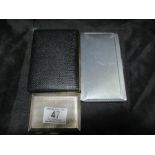 A hallmarked silver cigarette case (79.6g) along with two others