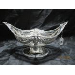 An impressive hallmarked silver basket engraved under the lip "The Sir John Tomes prize awarded by