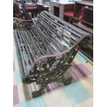 A vintage garden bench with cast iron sides and middle feet A/F