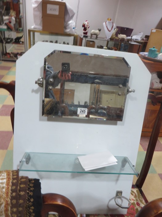 An Art Deco splashback with adjustable mirror