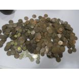 A collection of Victorian pennies, various threepenny bits and other coins