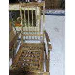 A teak steamer chair with foot rest A/F