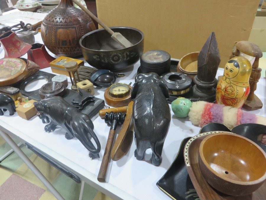 A box of wooden ware items to include carved animal figures, hand painted Russian box etc