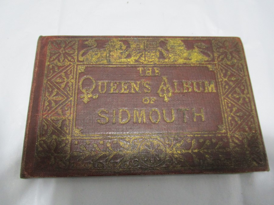 A wooden vesta along with "The Queen's Album of Sidmouth" a set of miniature postcards