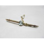 A 9 ct gold bar brooch with central aquamarine