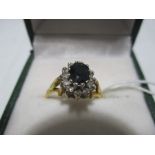 An 18ct gold diamond and sapphire cluster ring