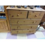 A pine chest of five drawers