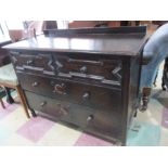 A Jacobean style chest of four drawers
