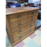 An oak chest of five drawers