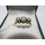 A diamond three stone ring set in 18ct gold