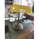 A reproduction antique style desk lamp