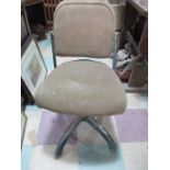 A Tan-Sad industrial swivel chair with adjustable back rest