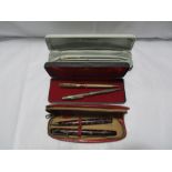 A small collection of pens and pencils, a hallmarked silver propelling "Truscraft" pencil, a