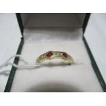 A 14ct gold ring set with diamonds and rubies