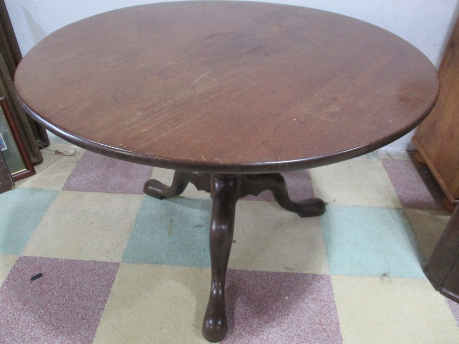A mahogany tripod occasional table with birdcage support