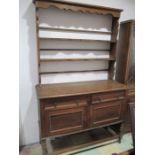 An oak open backed dresser on barley twist legs