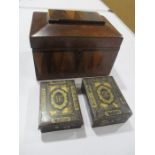 A parquetry tea caddy along with a pair of papermache games counter boxes with gilded decoration,