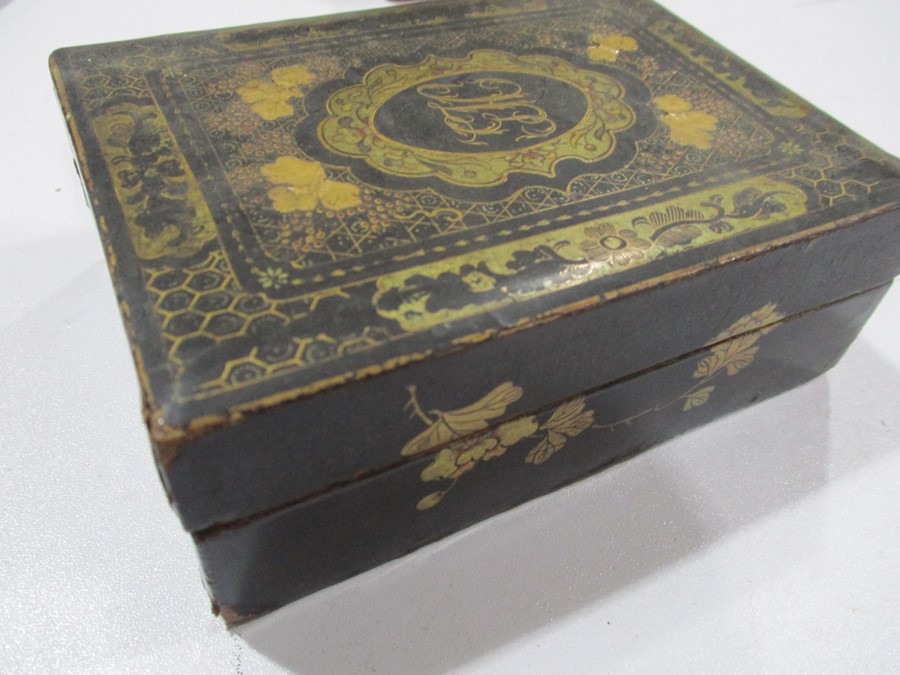 A parquetry tea caddy along with a pair of papermache games counter boxes with gilded decoration, - Image 12 of 13