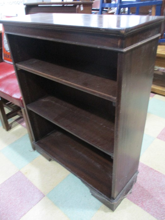 A set of dark wood freestanding shelves