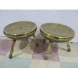 A good pair of Eastern/Islamic brass stools on tripod legs, diameter of top 37cm