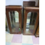 A pair of French wall mounted display cabinets with burr walnut veneer and ormolu mounts