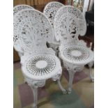 A set of four aluminium garden chairs