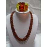 A Baltic amber necklace and matching bracelet