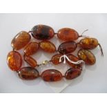 An amber necklace with inclusions, 91.2g