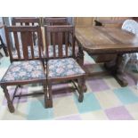 An oak drawleaf table and four chairs