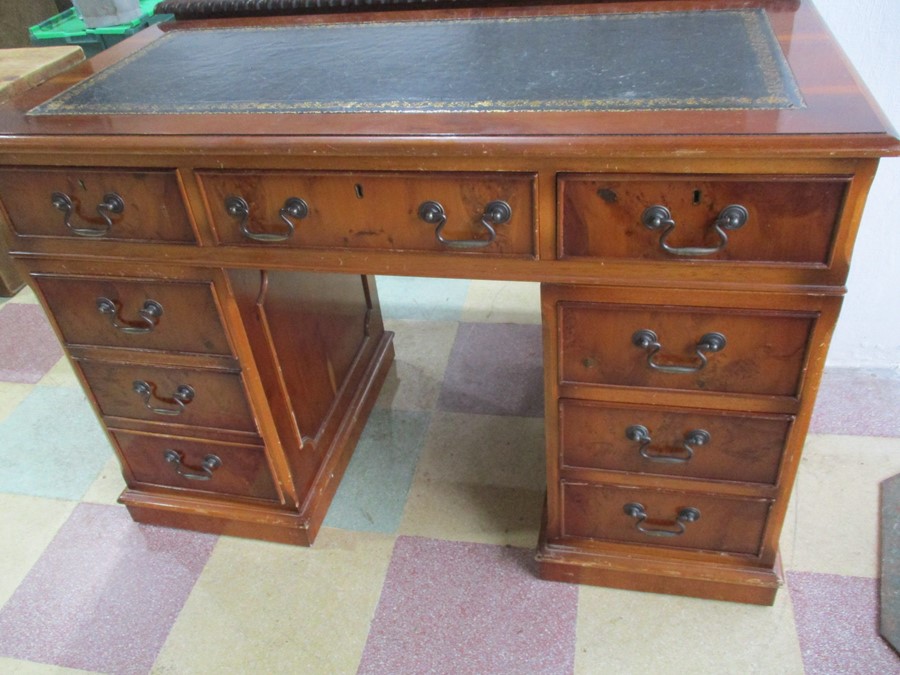 A yew wood kneehole desk