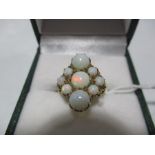 An opal nine stone ring set in 9ct gold - hallmark rubbed