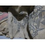 A large collection of burlap sacks, mainly advertising