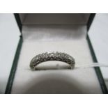 An 18 ct gold diamond 9 stone ring