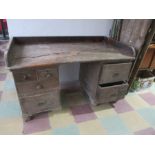A distressed pine kneehole desk/ counter