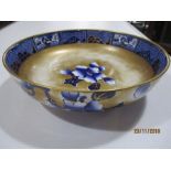 A Losol Ware bowl decorated with blue and gilt