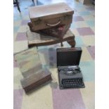 A vintage dressing case with partial contents, The Baby Empire typewriter, stool etc.