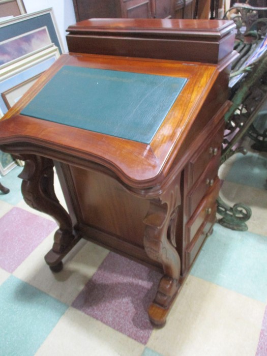 A reproduction Davenport with drawers on both sides