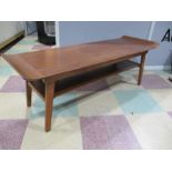 A mid century coffee table with raised ends