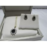 A Sapphire and CZ cluster pendant and earring set in 9 ct gold with 9 ct chain