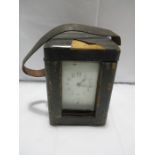 A brass carriage clock in leather travelling case A/F