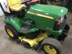 John Deere X748 compact tractor c/w mid mounted deck, reg. SF10 GZY When tested was seen to run