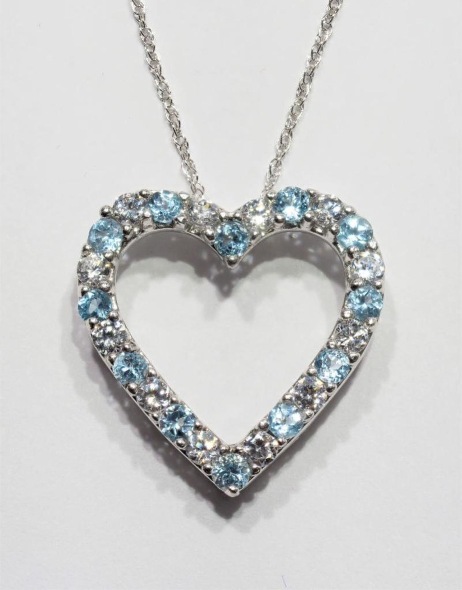 Sterling Silver Genuine Blue Topaz Heart Pendant Necklace with Chain. Retail $250