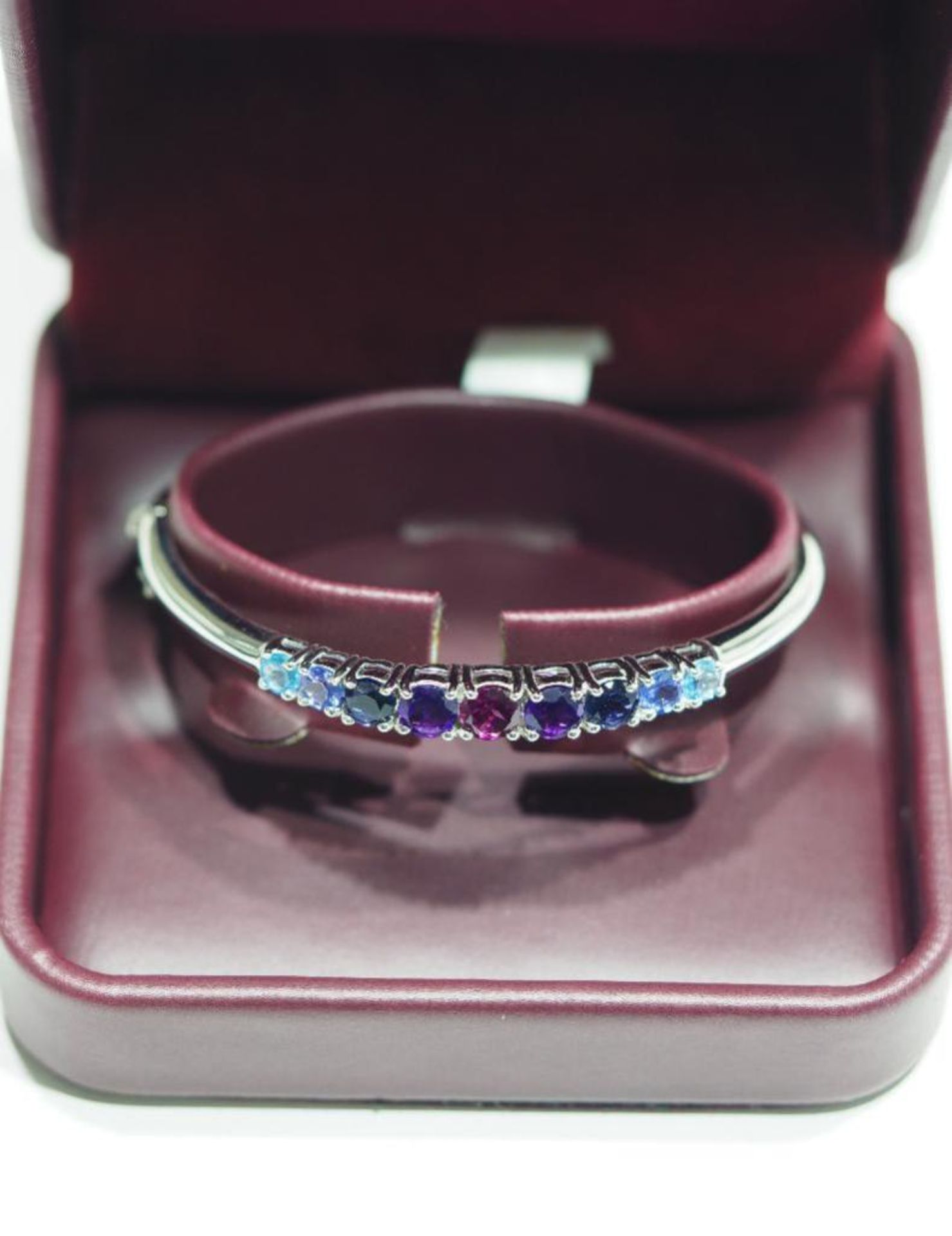 Sterling Silver Bangle with Garnet, Amethyst, Blue Topaz, Tanzanite and Iolite. Appraised $450 - Image 2 of 4