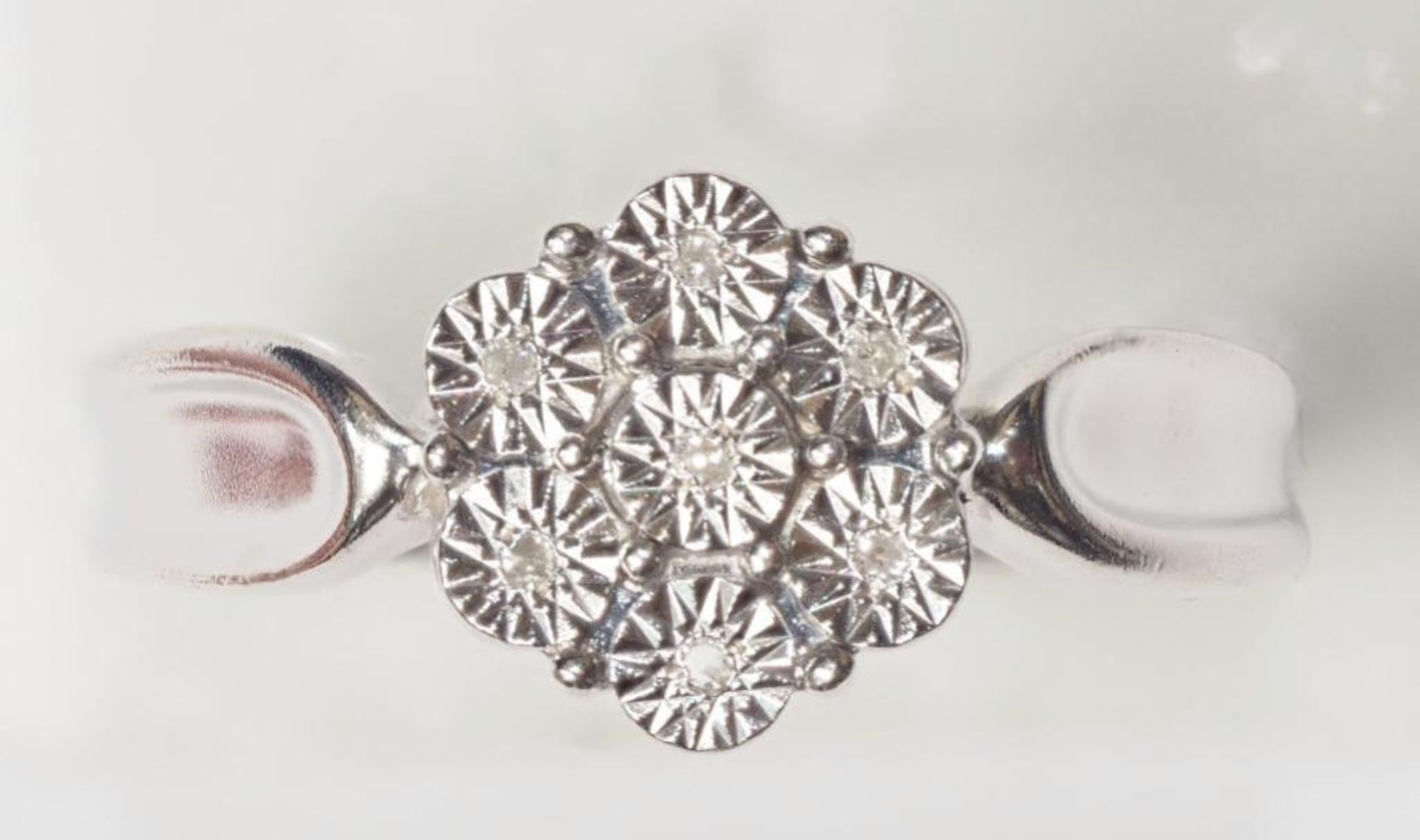 Sterling Silver Ring with 7 Diamonds in Illusion Setting. Retail $200