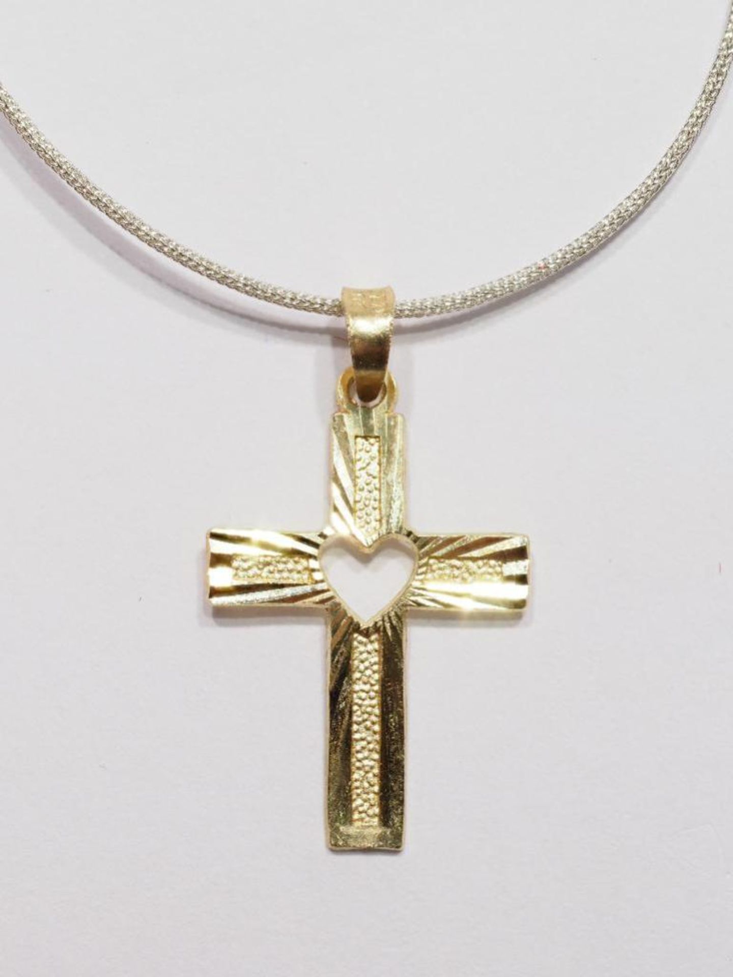 10Kt Gold Cross Pendant on High Fashion Cord. Retail $300