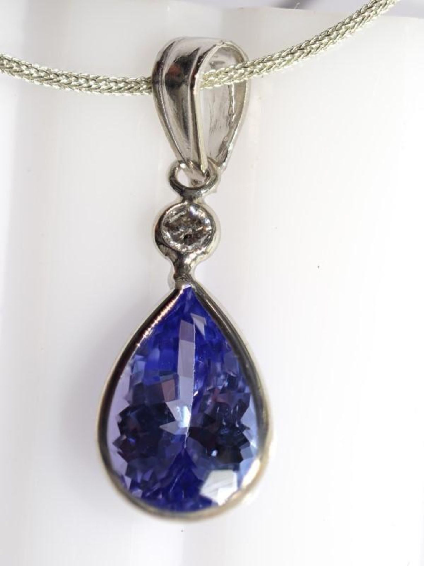 14K White Gold Tanzanite(2.0ct) Diamond (0.06ct) Pendant with Sterling Silver Chain. Insurance Value