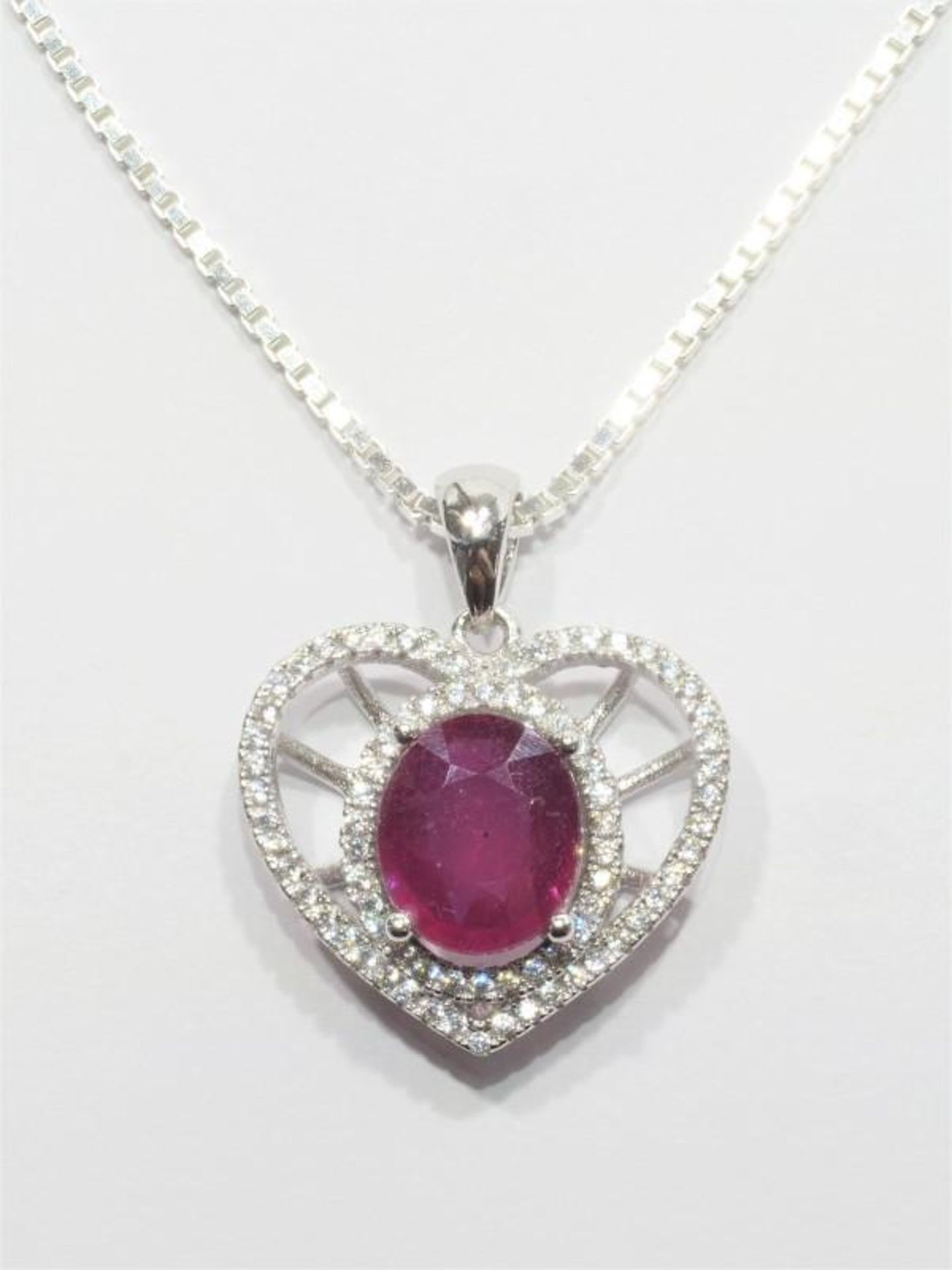 Sterling Silver Rhodium Plated Enhanced Ruby Heart Pendant with Chain. Retail $400