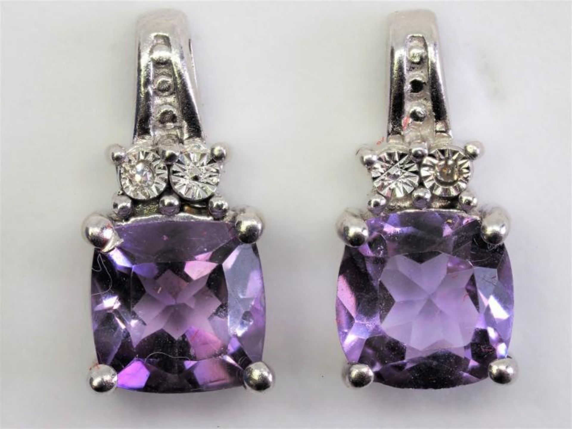 Sterling Silver Amethyst (February Birthstone) and Diamond Earrings. Retail $240