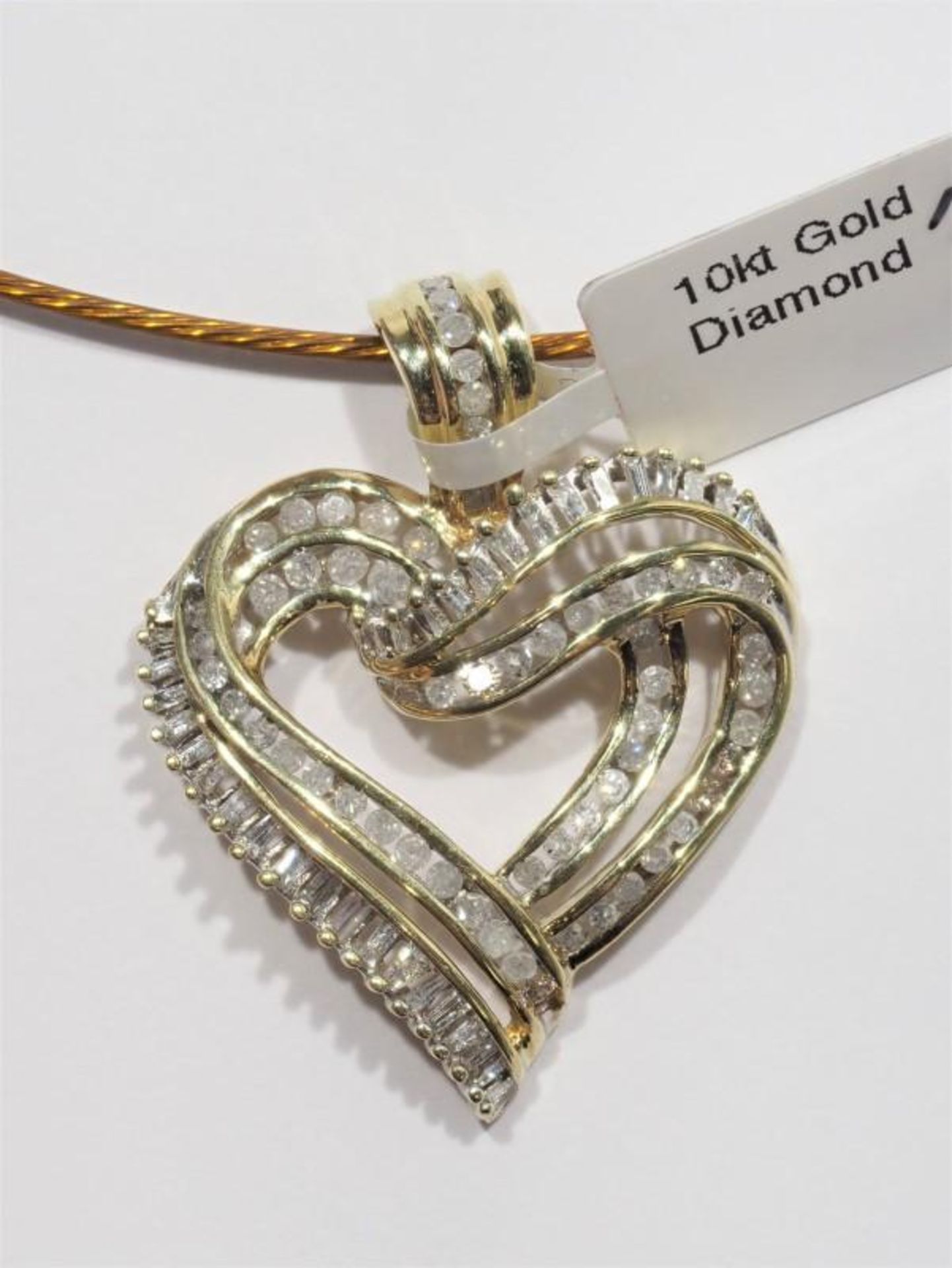 10K Yellow Gold Diamond (1.1ct) Heart Shaped Pendant with High Fashion Cord. Insurance Value $2600 (